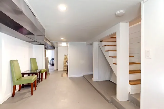 a view of a hallway with seating area