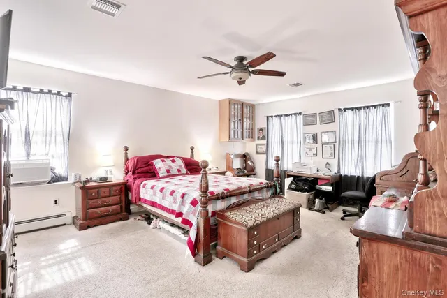 a bedroom with a bed and dresser