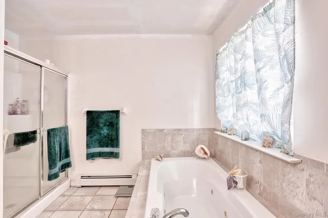 a spacious bedroom with a bed and large windows