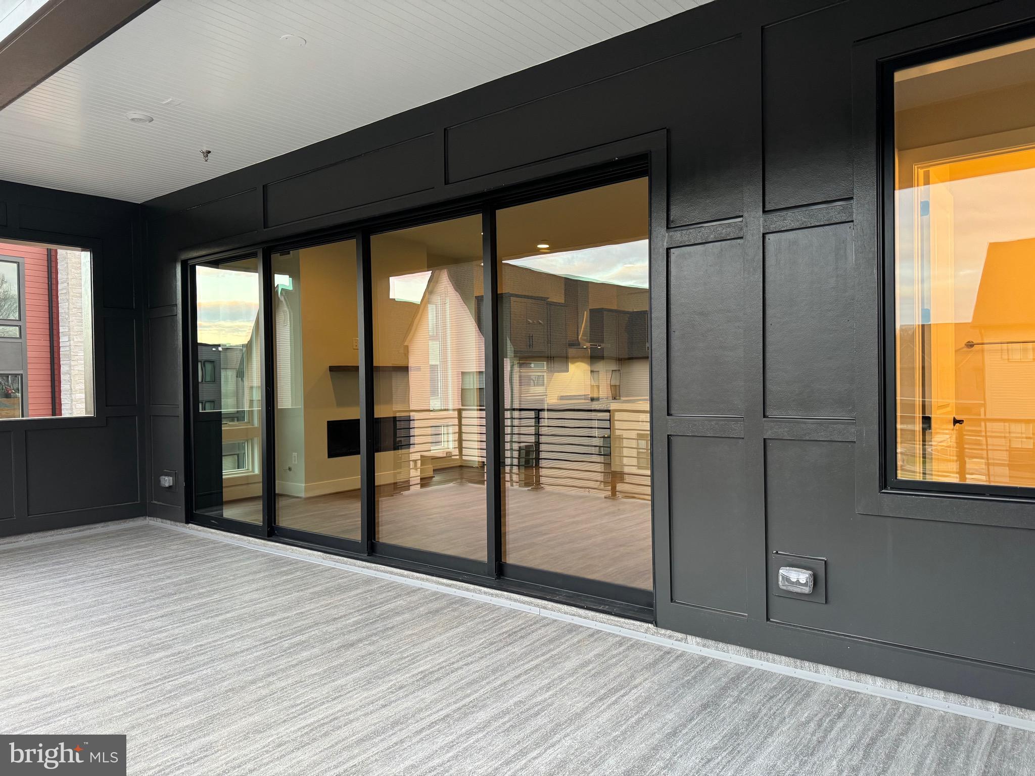 9779 Azure Alley Bethesda, MD 20817 - Photo 16 of 48 Wall to wall doors to the deck