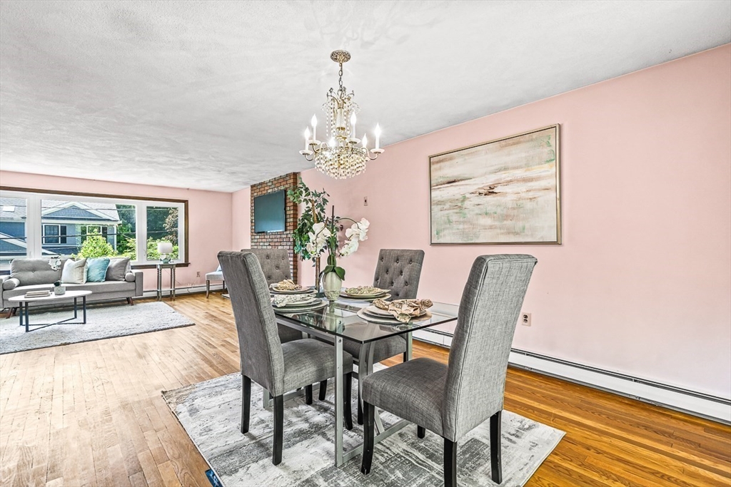7-9 Cleveland Road Winchester, MA 01890 - Photo 6 of 38 a view of a dining room with furniture and a chandelier