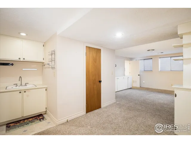 a view of a kitchen with a sink