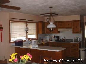 0 Bunnell Hill Road Meshoppen, PA 18630 - Photo 4 of 5 a kitchen with stainless steel appliances granite countertop a sink a stove and a granite counter top