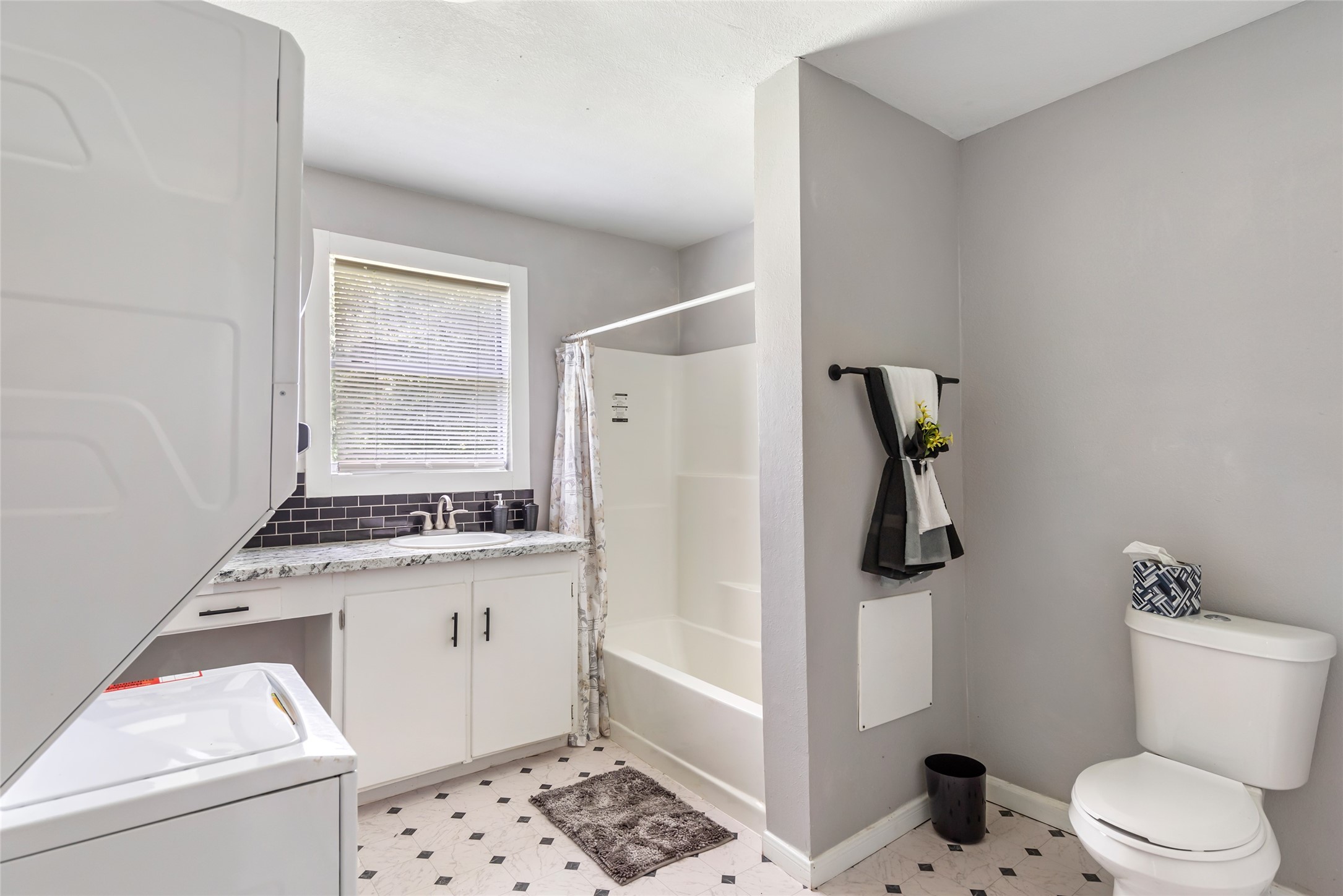 26864 Morgan Cemetery Road Cleveland, TX 77328 - Photo 15 of 26 a bathroom with a granite countertop toilet sink and shower