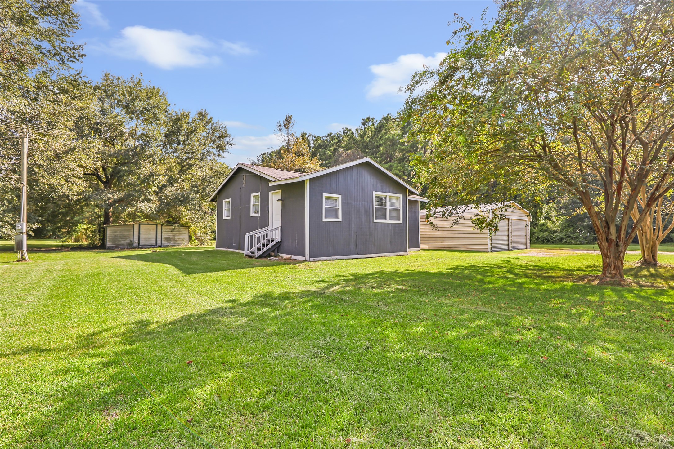 26864 Morgan Cemetery Road Cleveland, TX 77328 - Photo 2 of 26 a view of a house with a big yard