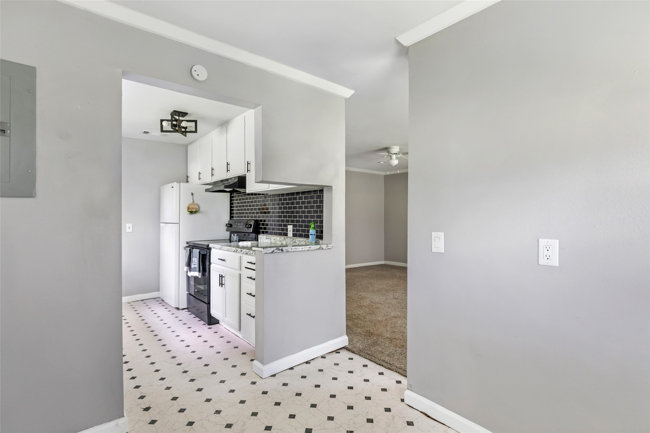 26864 Morgan Cemetery Road Cleveland, TX 77328 - Photo 23 of 26 a kitchen with a refrigerator and a stove top oven