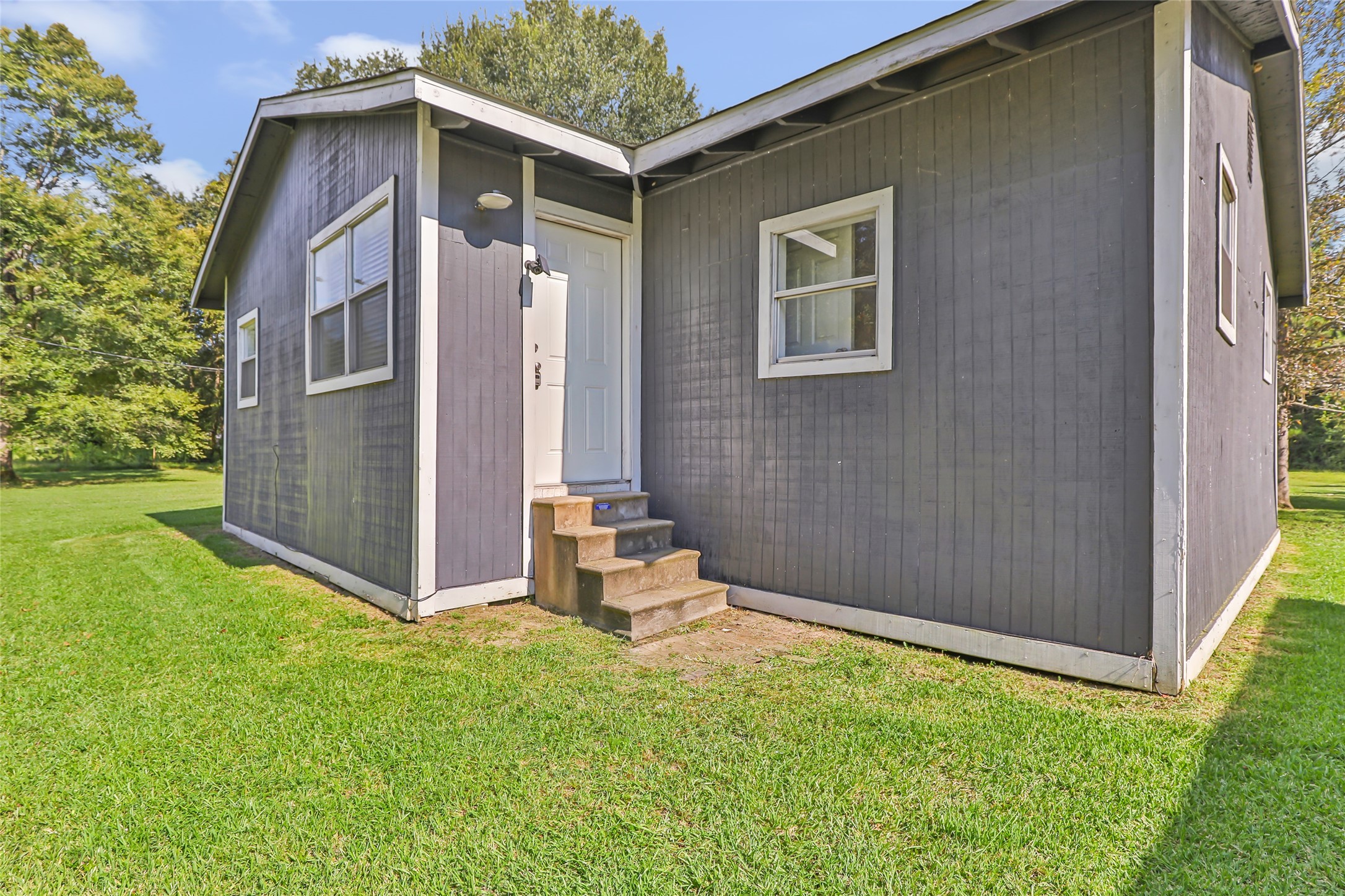 26864 Morgan Cemetery Road Cleveland, TX 77328 - Photo 9 of 26 a backyard of a house with seating space