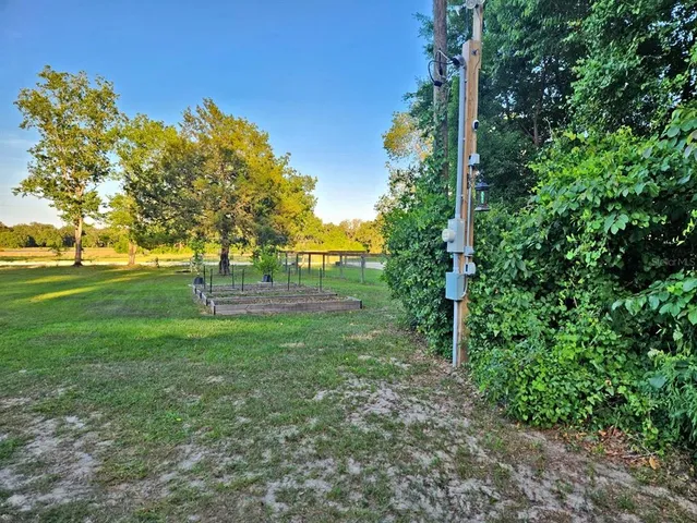 a view of outdoor space with deck and yard