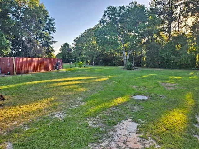 a view of a golf course with a trees