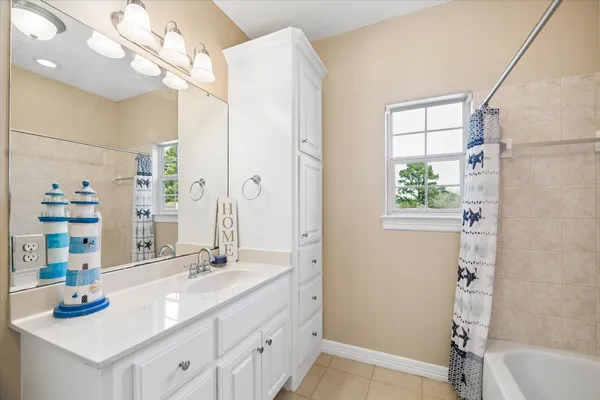 a bathroom with a sink a vanity and a mirror
