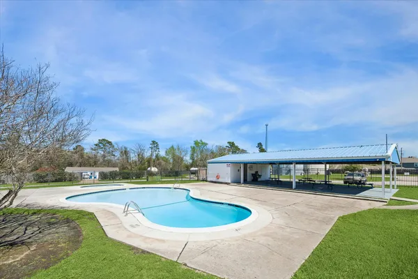 a view of a swimming pool with a patio