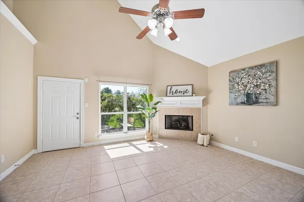 a view interior of a house with plants and a fireplace