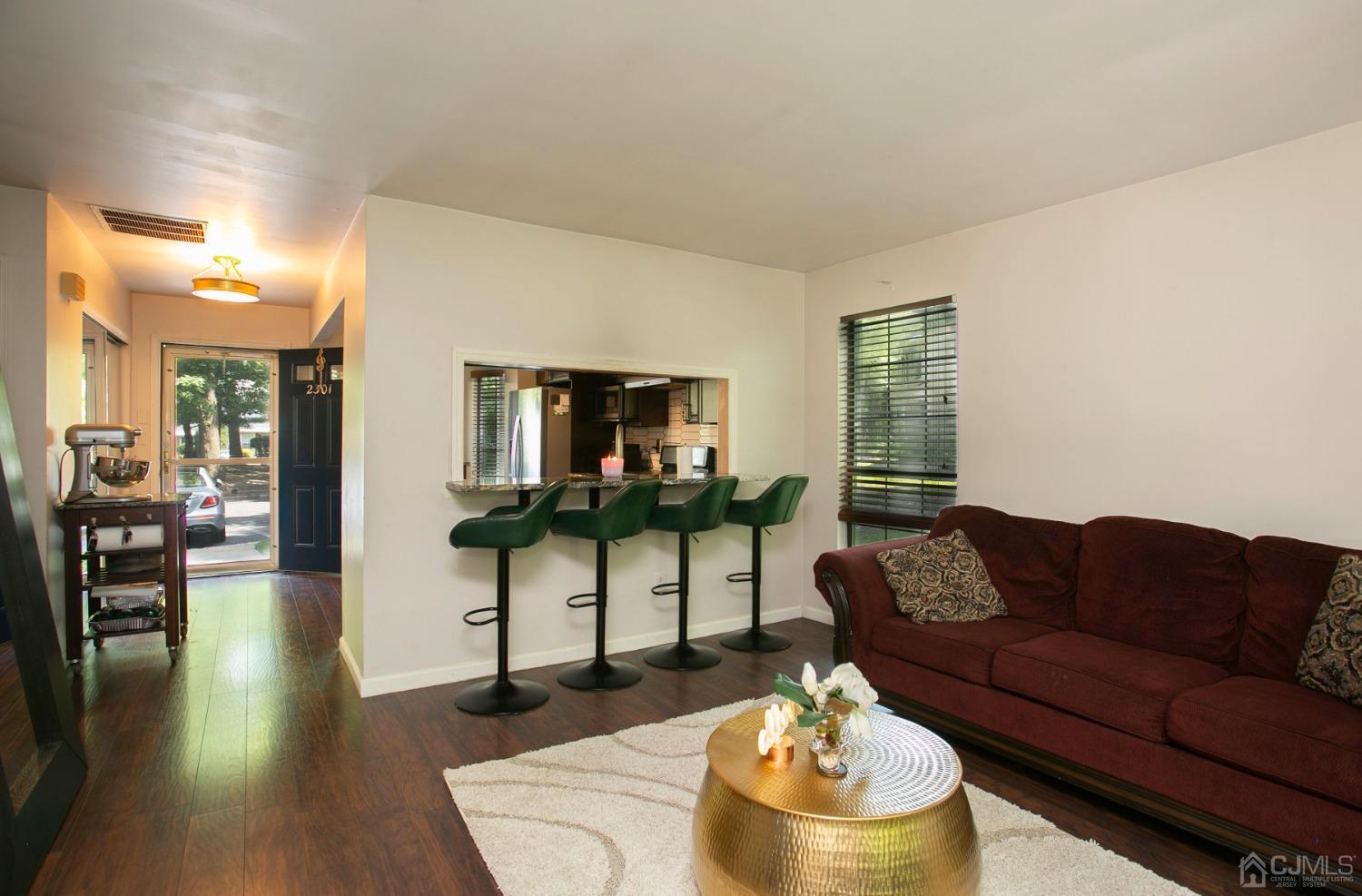 2301 Timber Oaks Road Edison, NJ 08820 - Photo 8 of 17 a living room with furniture and a wooden floor