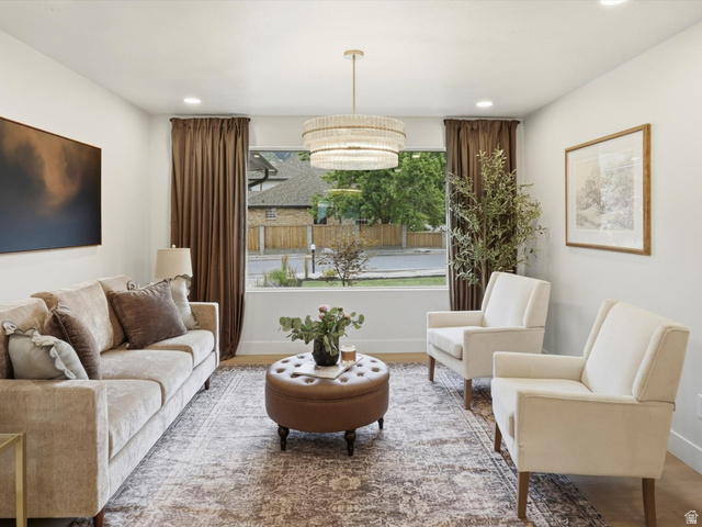 8760 Rustler Road Cottonwood Heights, UT 84093 - Photo 6 of 57 Bright living area with light-toned walls and wood-finish flooring
