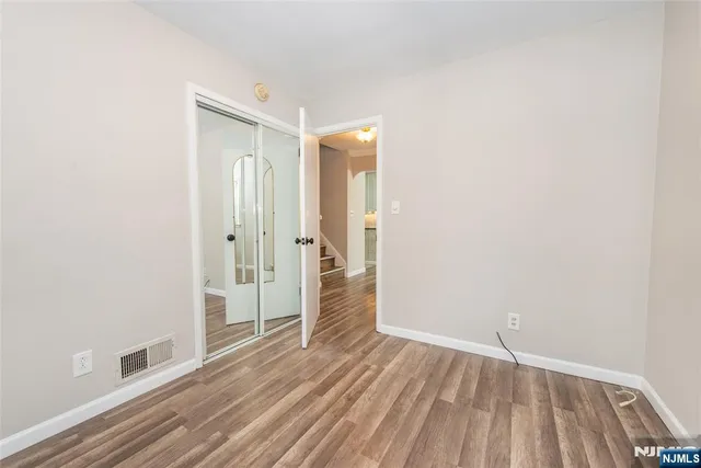 a bathroom with a sink and mirror with toilet