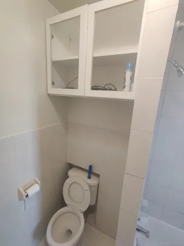 a bathroom with a toilet and a sink