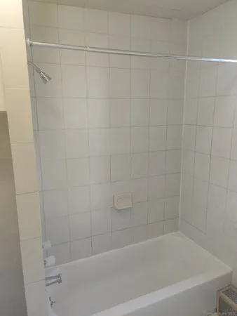 a close up of a bathtub curtain