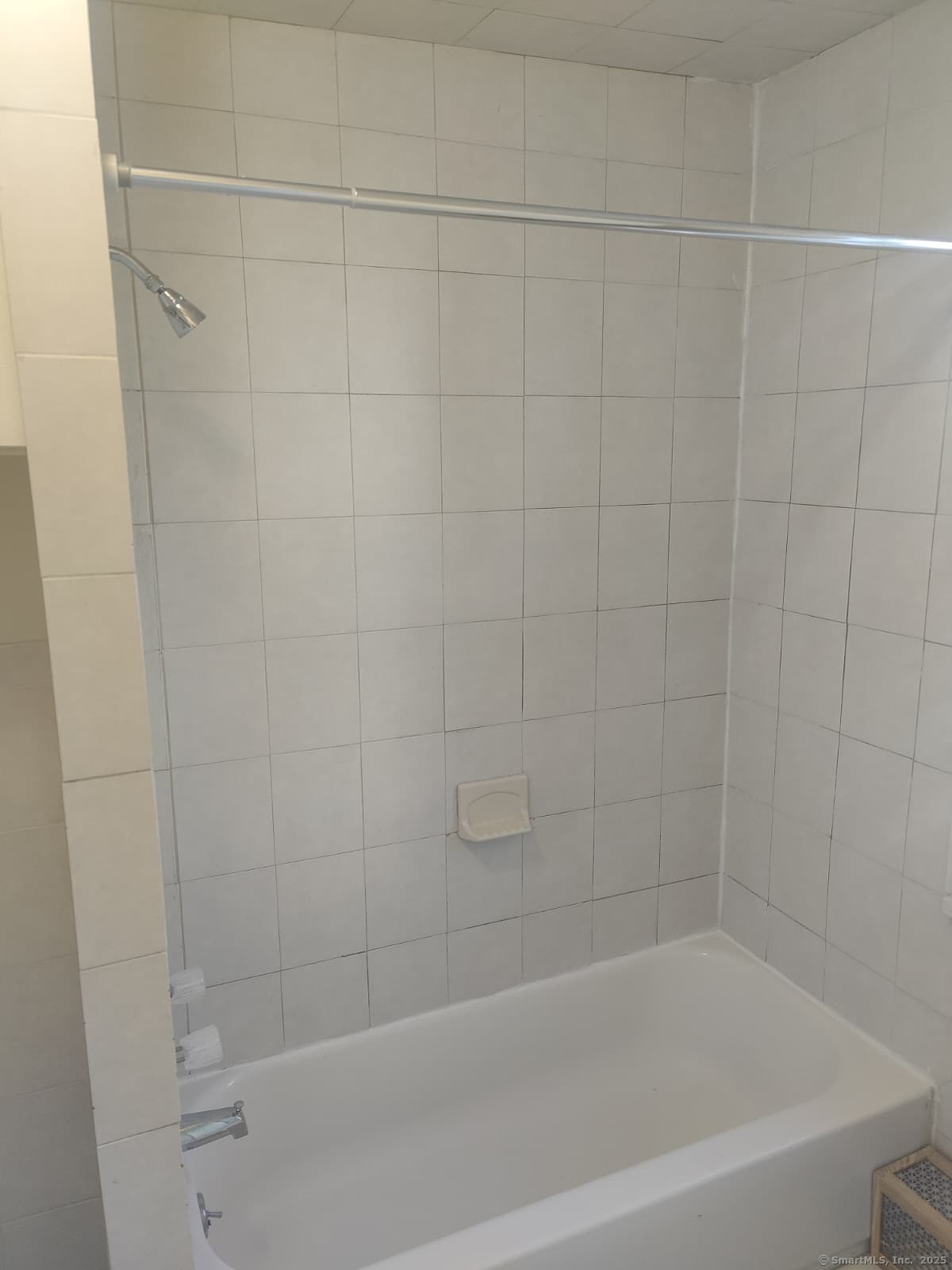 322 Catherine Street Bridgeport, CT 06604 - Photo 20 of 28 a close up of a bathtub curtain