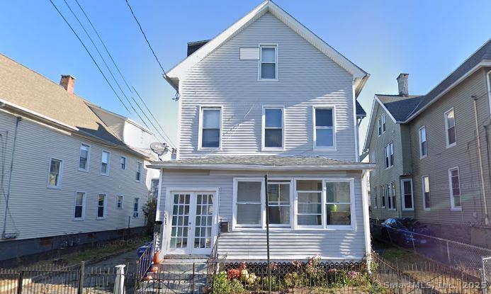 322 Catherine Street Bridgeport, CT 06604 - Photo 2 of 28 a front view of a house with balcony