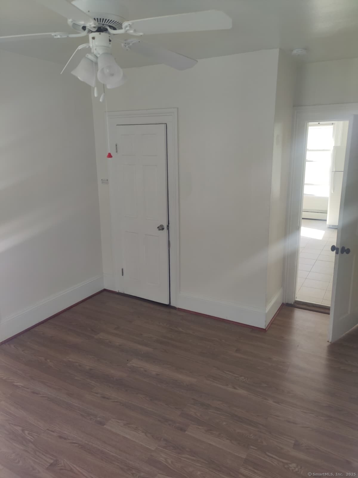 322 Catherine Street Bridgeport, CT 06604 - Photo 26 of 28 a view of an empty room and wooden floor