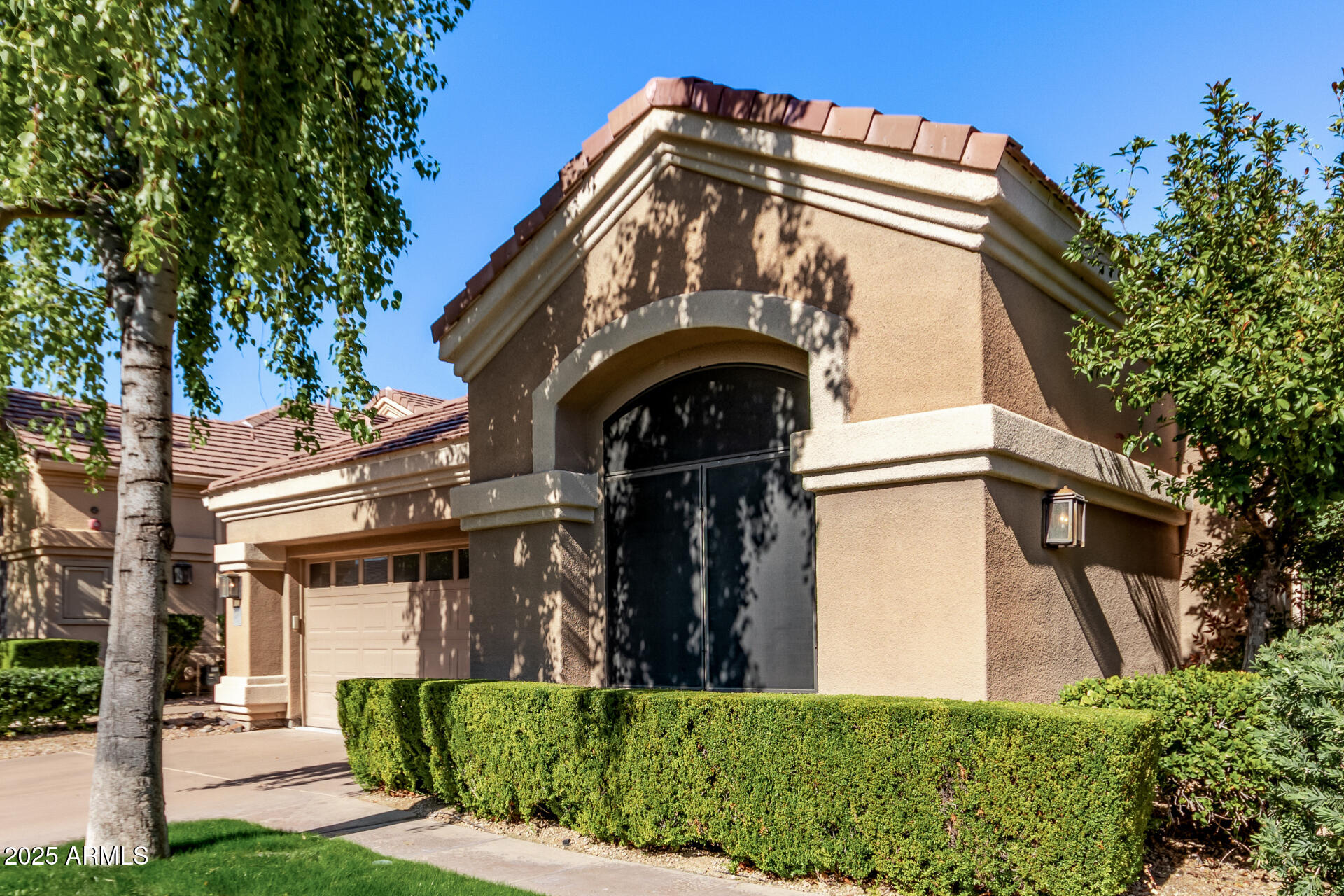 7525 East Gainey Ranch Road, Unit 124 Scottsdale, AZ 85258 - Photo 3 of 33 a view of a house with a small yard