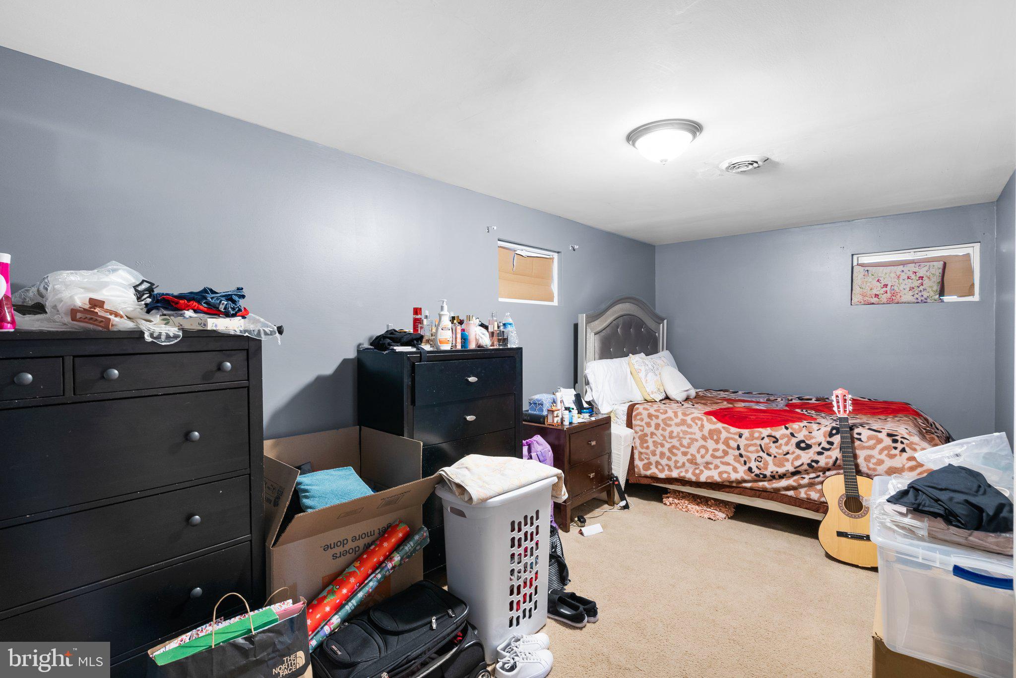 2601 Tucker Road Fort Washington, MD 20744 - Photo 24 of 30 a bedroom with a bed and a chandelier