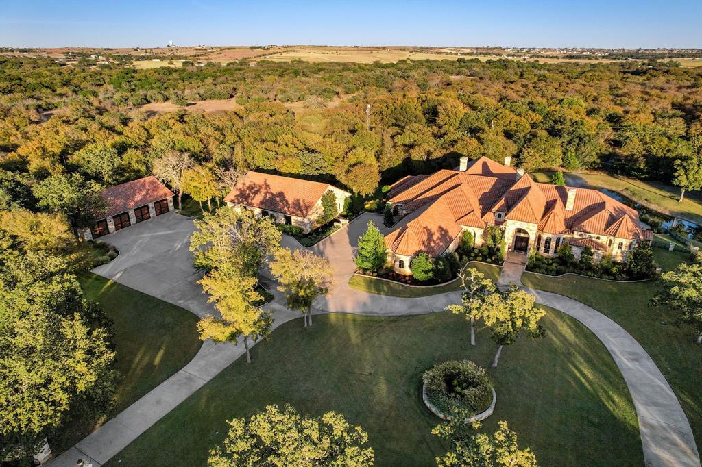 View of property location with a heavily wooded area