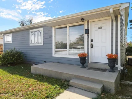 a house view with a sitting space and garden space