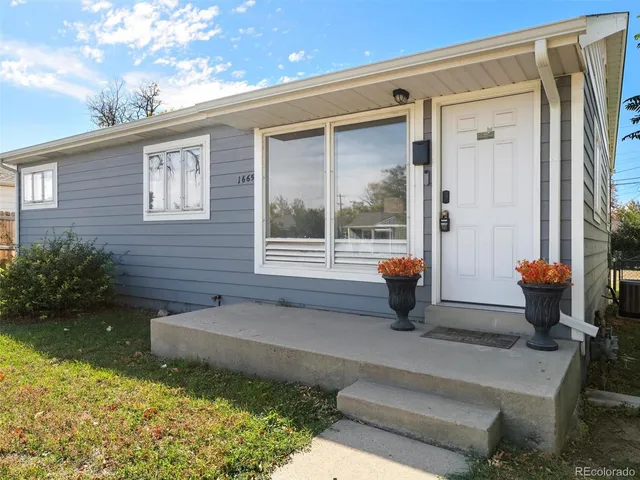 a house view with a sitting space and garden space