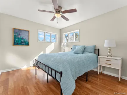 a bedroom with a bed and a table in it