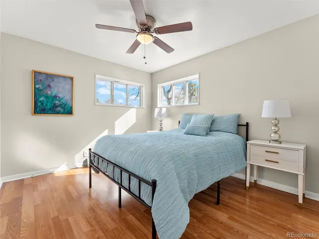 a bedroom with a bed and a table in it