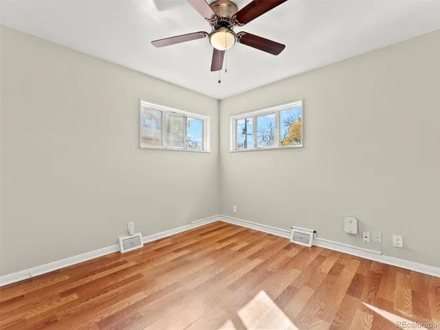 a view of room with window and ceiling fan