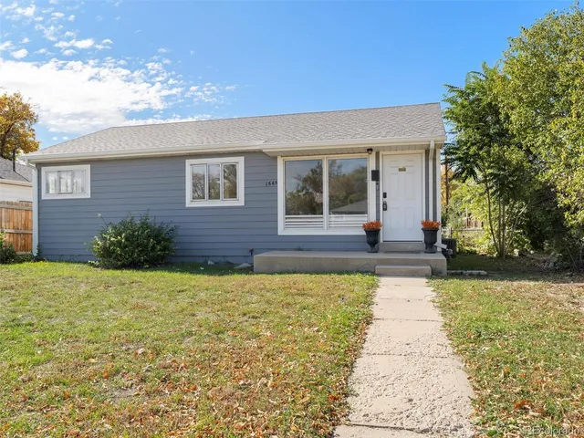 front view of a house with a yard