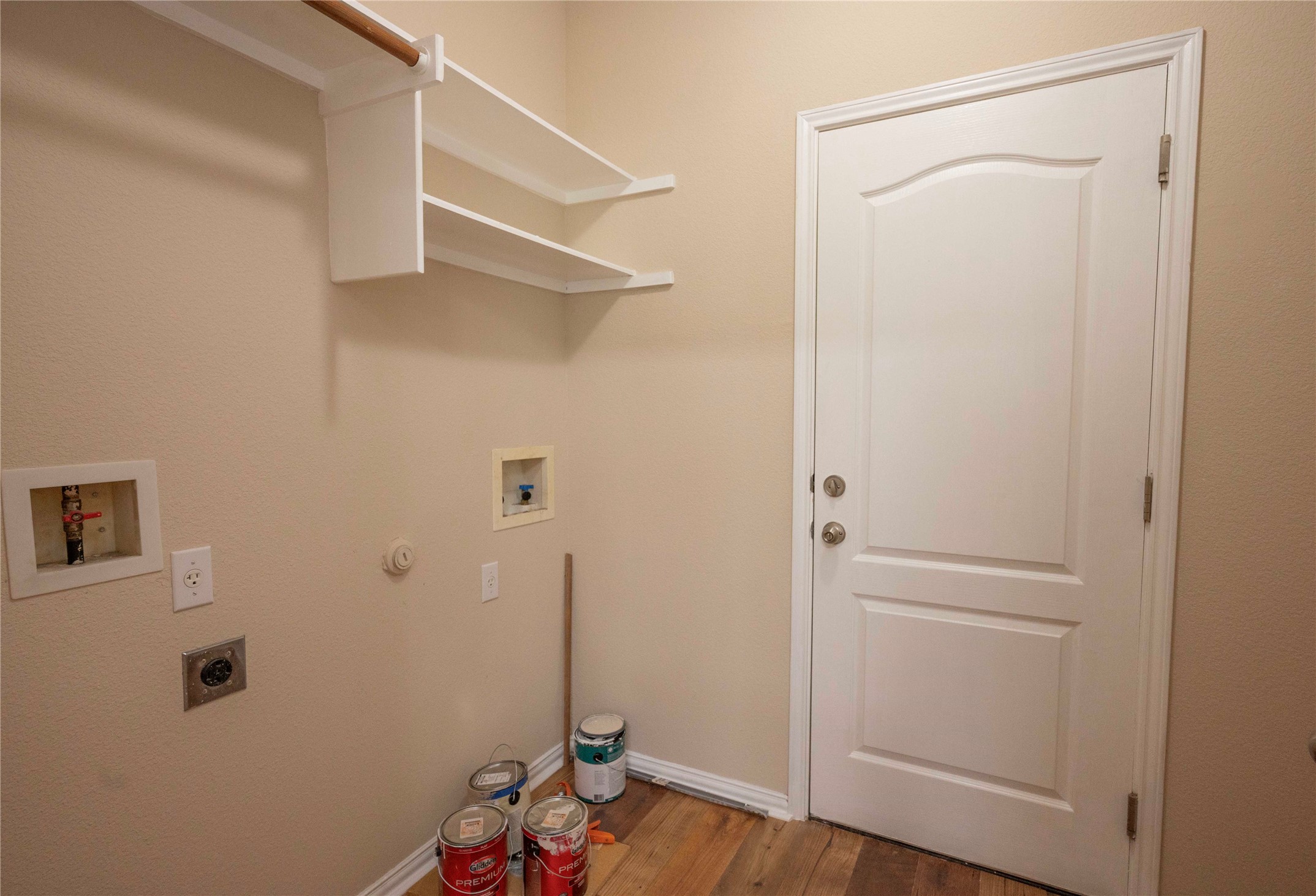 2070 Intrepid Drive Buda, TX 78610 - Photo 19 of 31 Ample shelving above dedicated connections for laundry appliances completes this functional utility space.