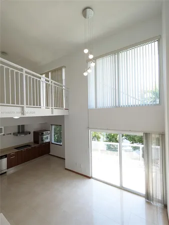 a view of livingroom with furniture and windows