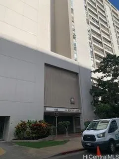 a front view of a house with plants