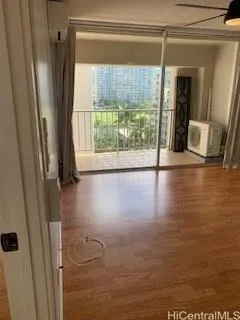 a view of a glass door with a yard from a window