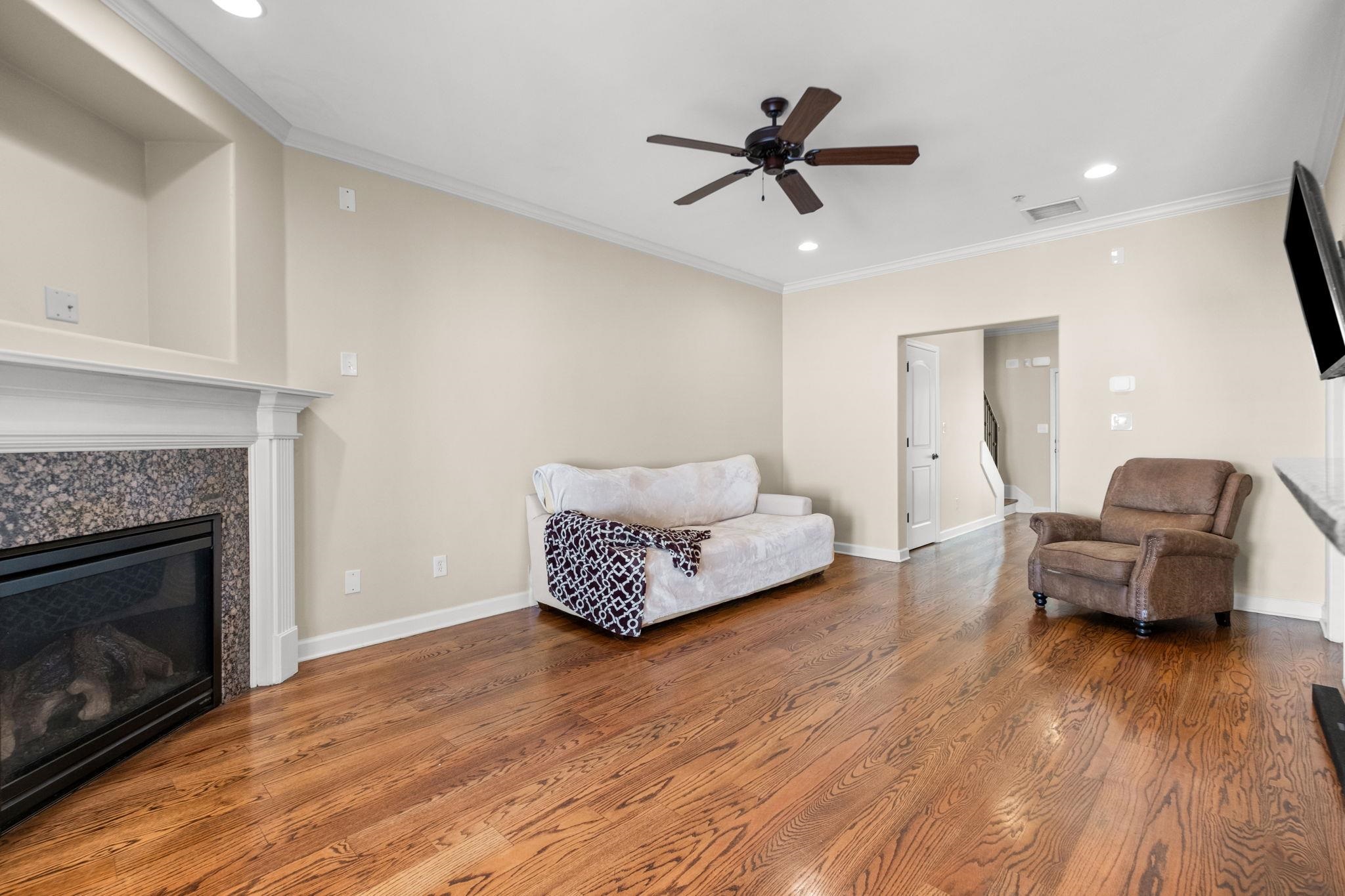2275 McVay Road, Unit 2275 Germantown, TN 38138 - Photo 9 of 40 a living room with furniture and a fireplace
