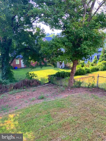 a view of a backyard with swimming pool