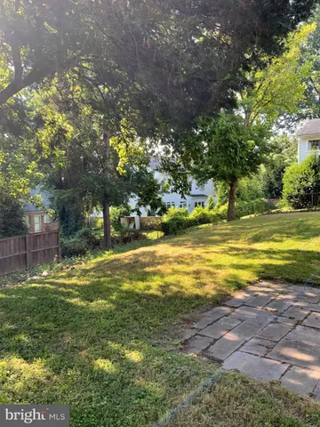 a view of a yard with swimming pool