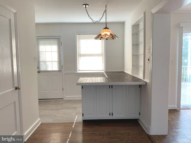 a view of kitchen and windows