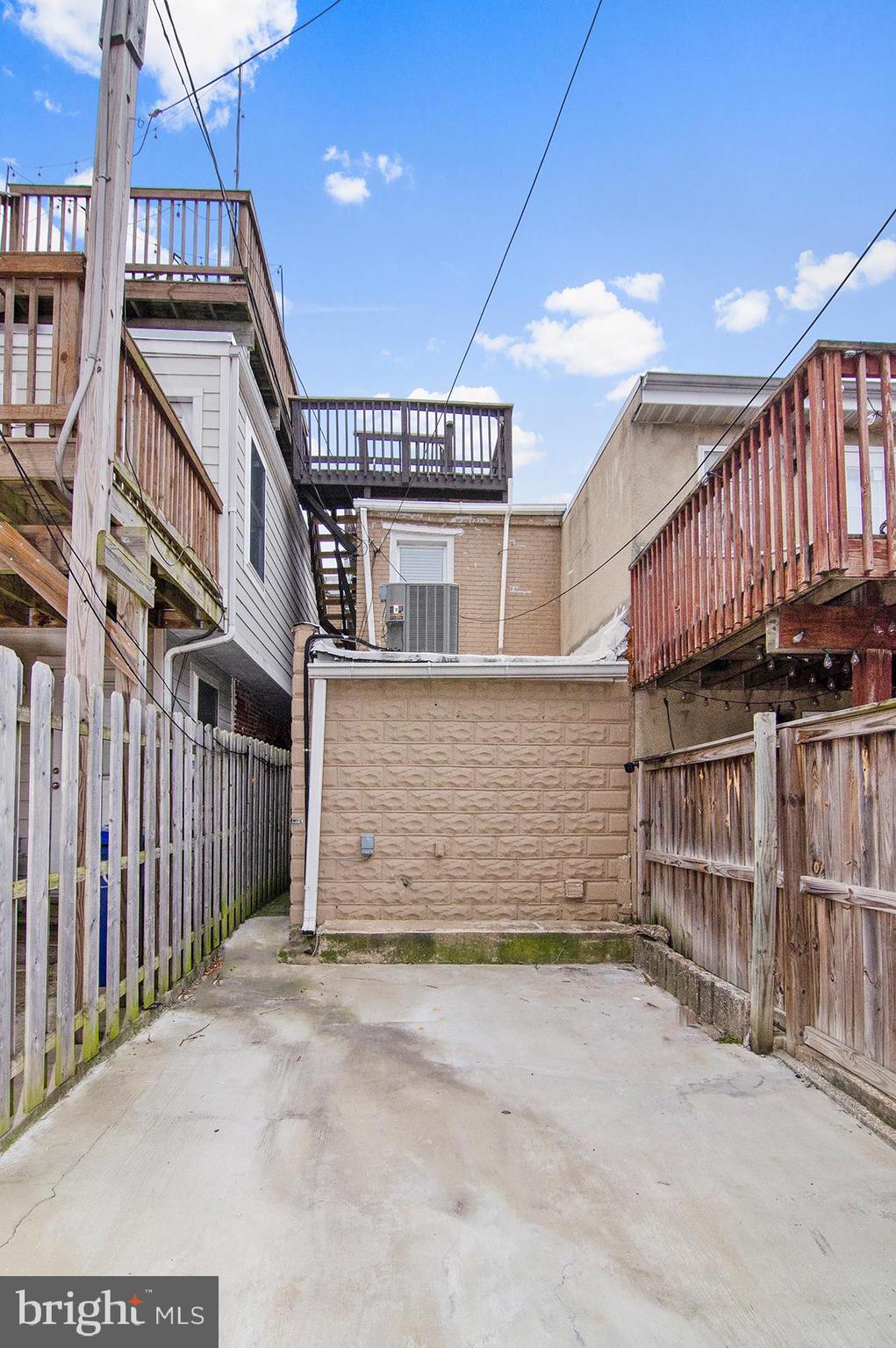 1815 South Charles Street Baltimore, MD 21230 - Photo 22 of 27 a view of a house with wooden stairs