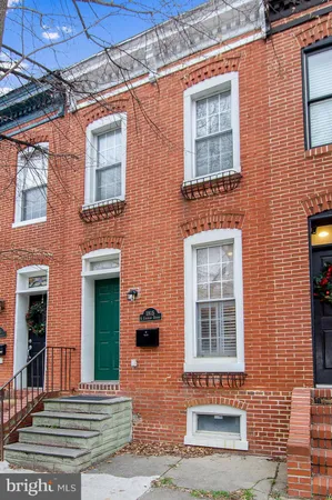 a view of a brick building with many windows