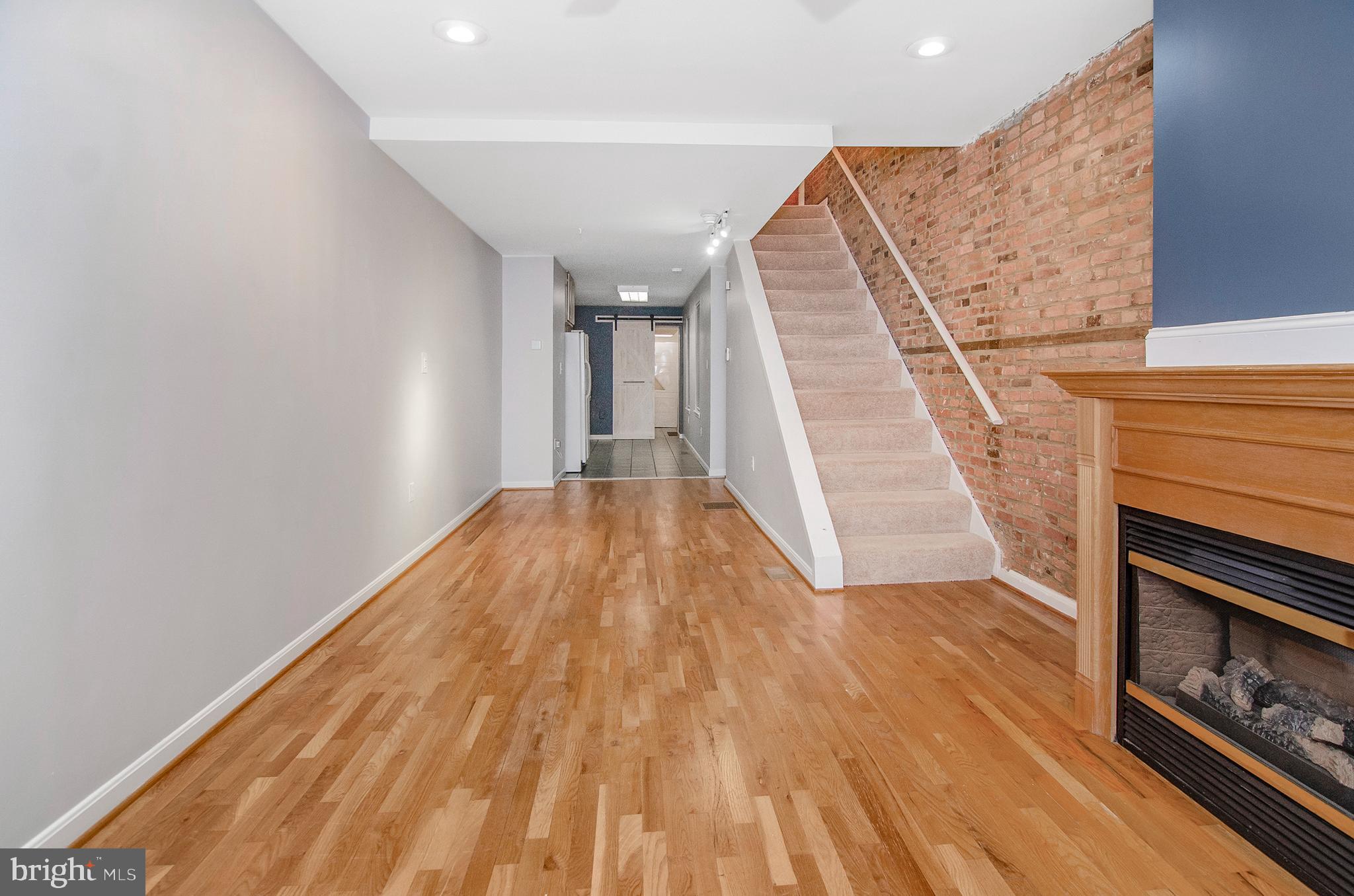 1815 South Charles Street Baltimore, MD 21230 - Photo 5 of 27 a view of empty room with wooden floor
