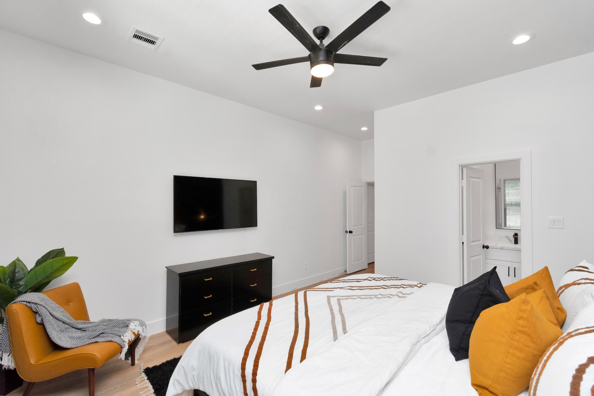 5308 Denmark Street Houston, TX 77028 - Photo 20 of 36 a bedroom with a bed and a couch