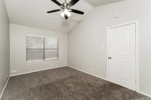 a view of an empty room with a window