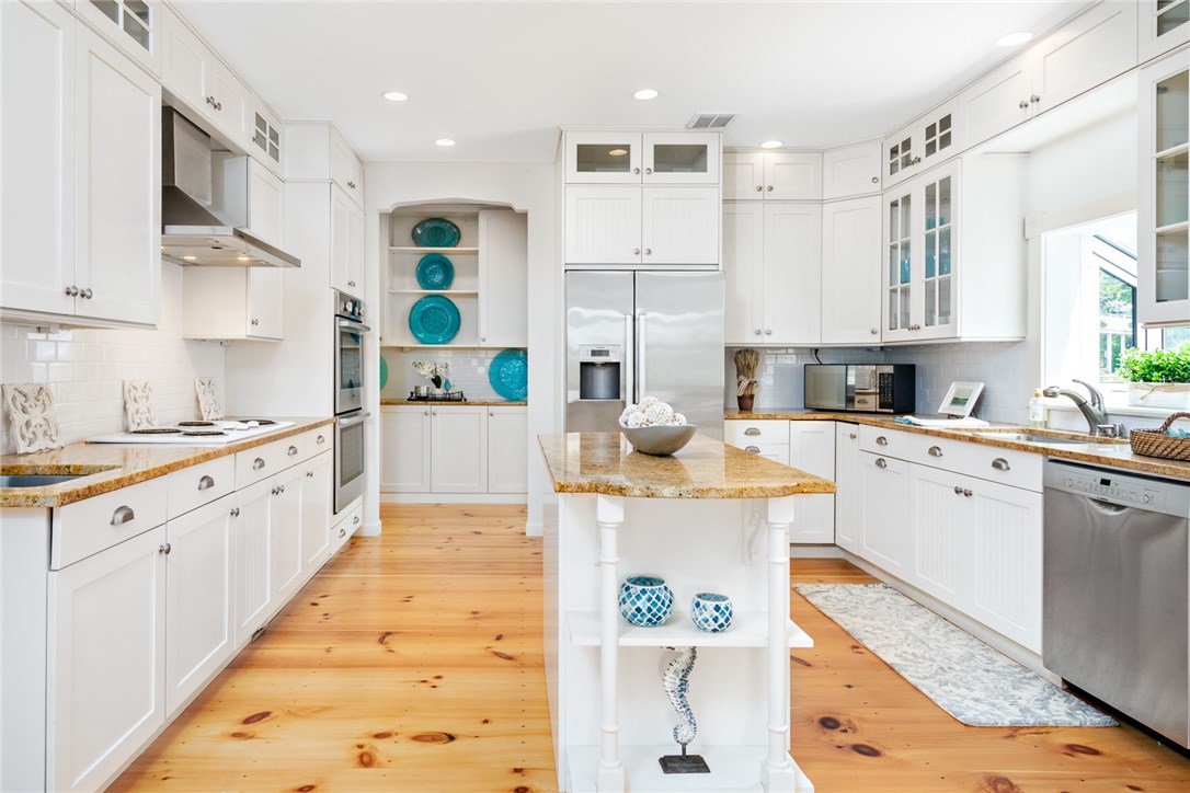 35 Lake Road Narragansett, RI 02882 - Photo 5 of 49 Pantry to the back of the kitchen has addition space for all of your serving pieces and stemware
