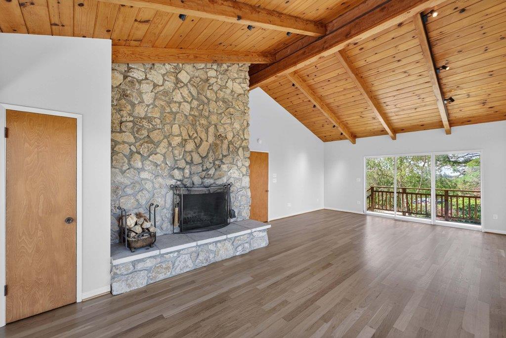 505 Hidden Valley Road Watsonville, CA 95076 - Photo 27 of 72 a view of empty room with wooden floor and fireplace