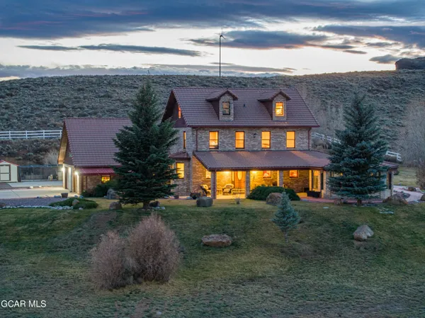 a aerial view of a house with a yard