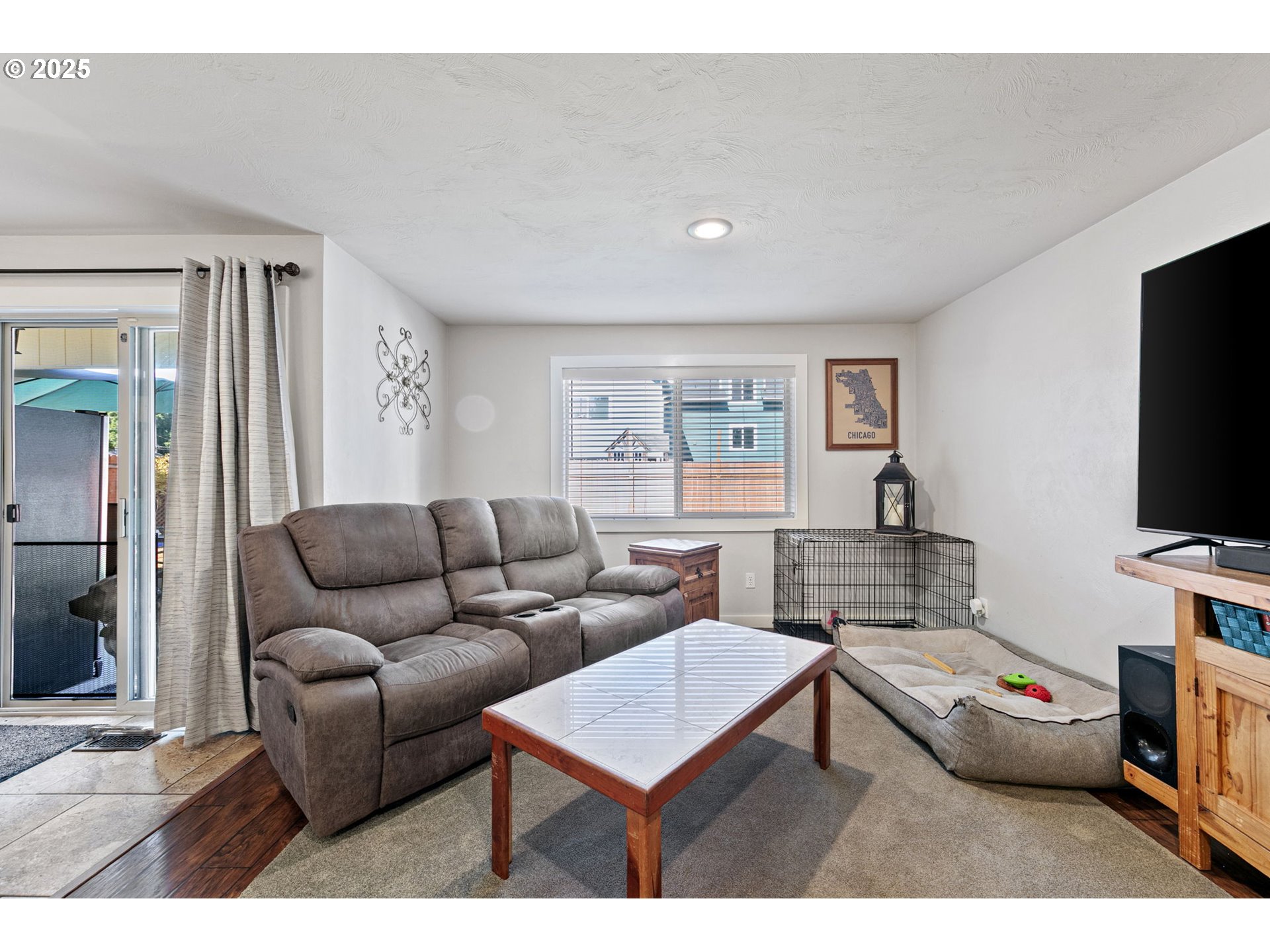 1011 Rose Street Junction City, OR 97448 - Photo 19 of 44 a living room with furniture and a flat screen tv